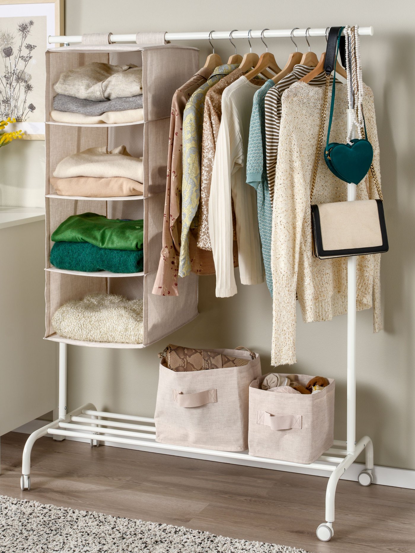 A textile/beige PURRPINGLA hanging storage w 4 compartments in the bedroom