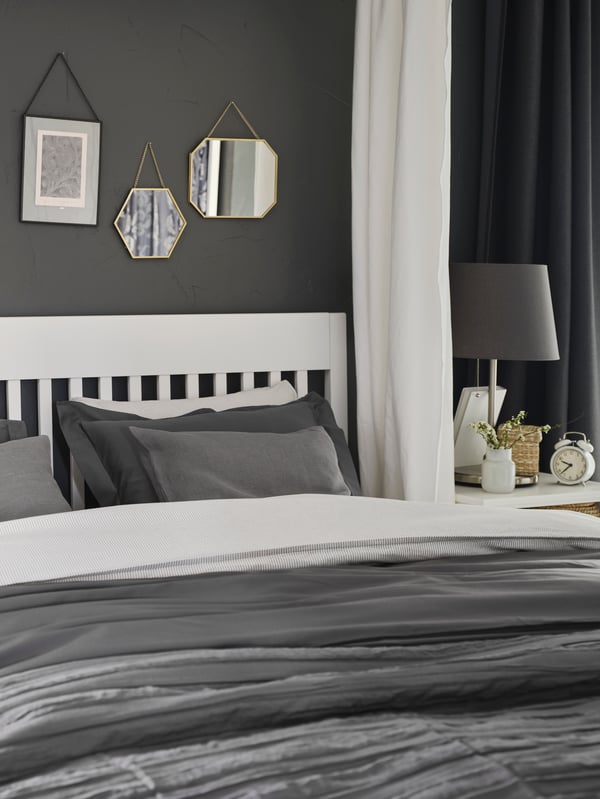 A grey SKOTTORP lampshade in the bedroom