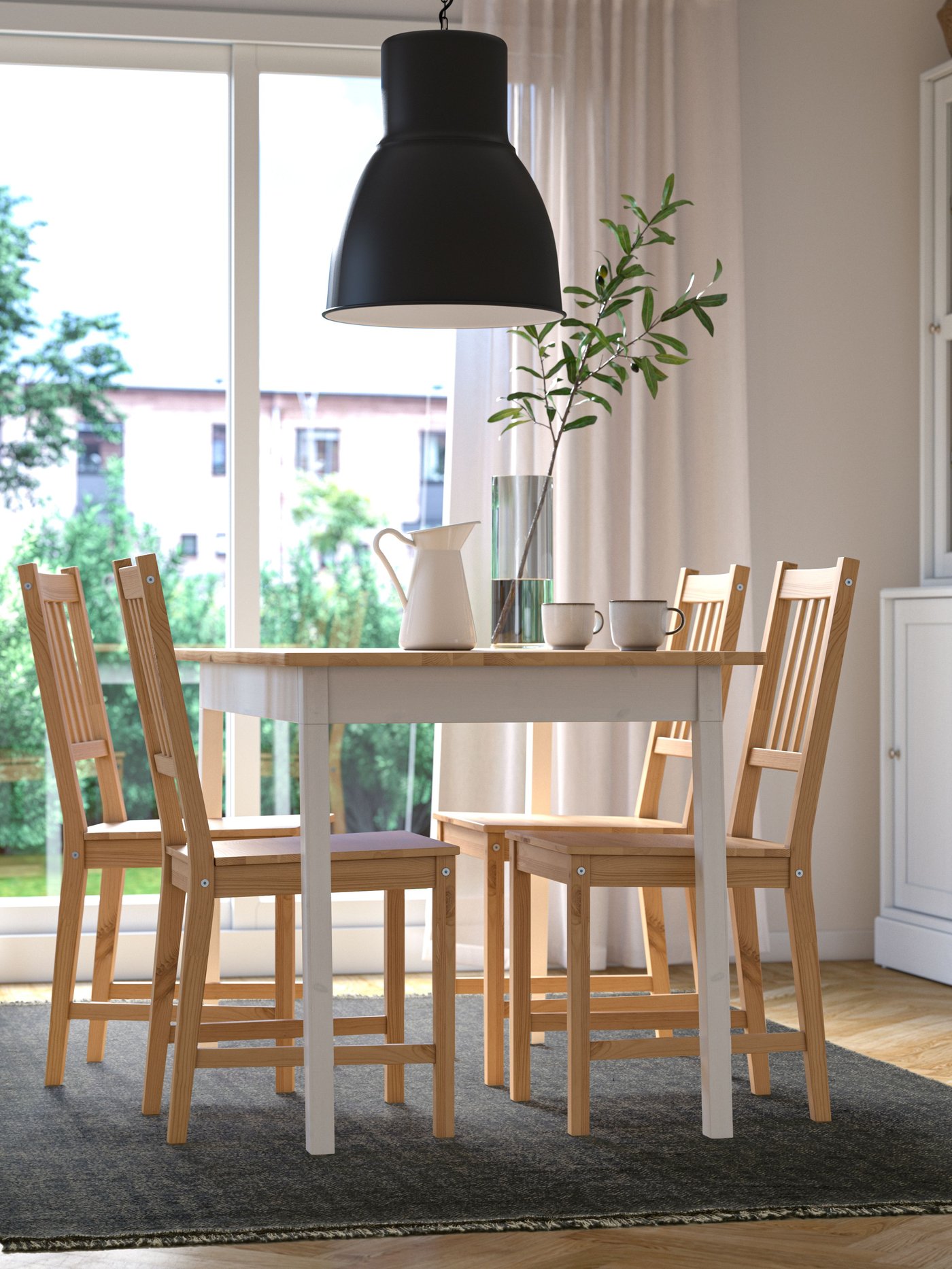 A dark blue/light beige LOKBYTE rug, flatwoven in the dining room