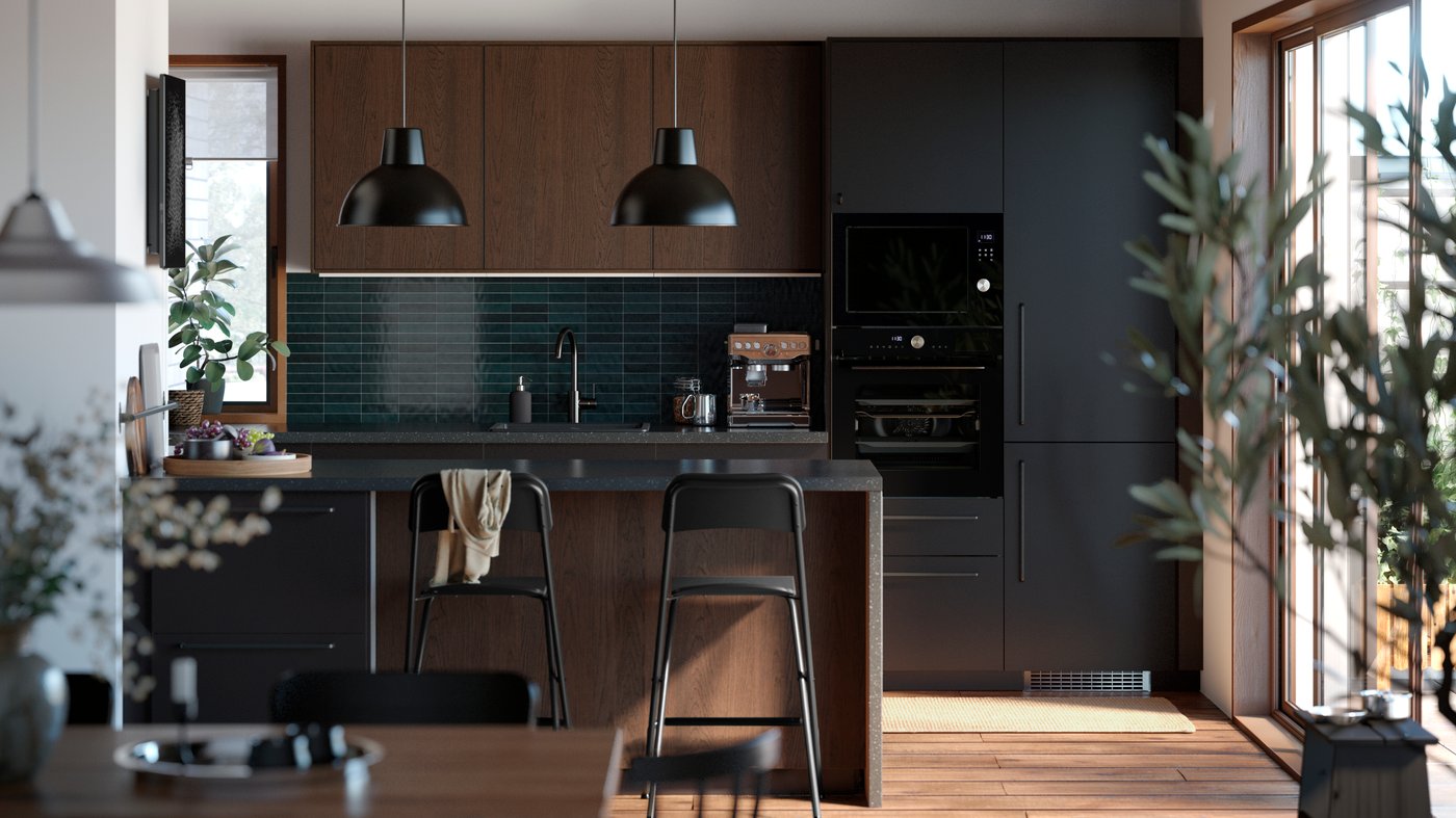 A kitchen with black and brown fronts in a modern style.