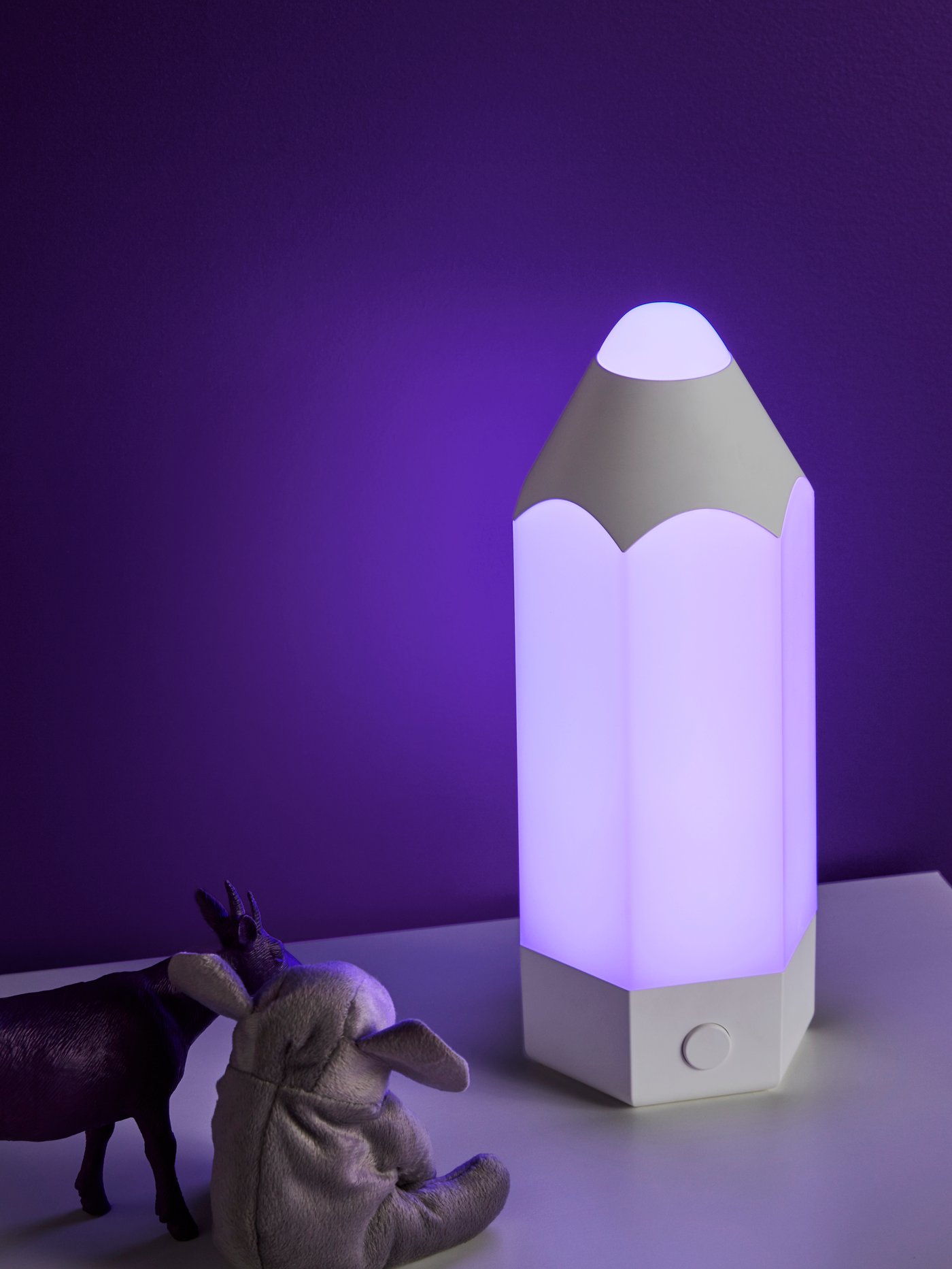 A multicolour PELARBOJ LED table lamp in the childrens room