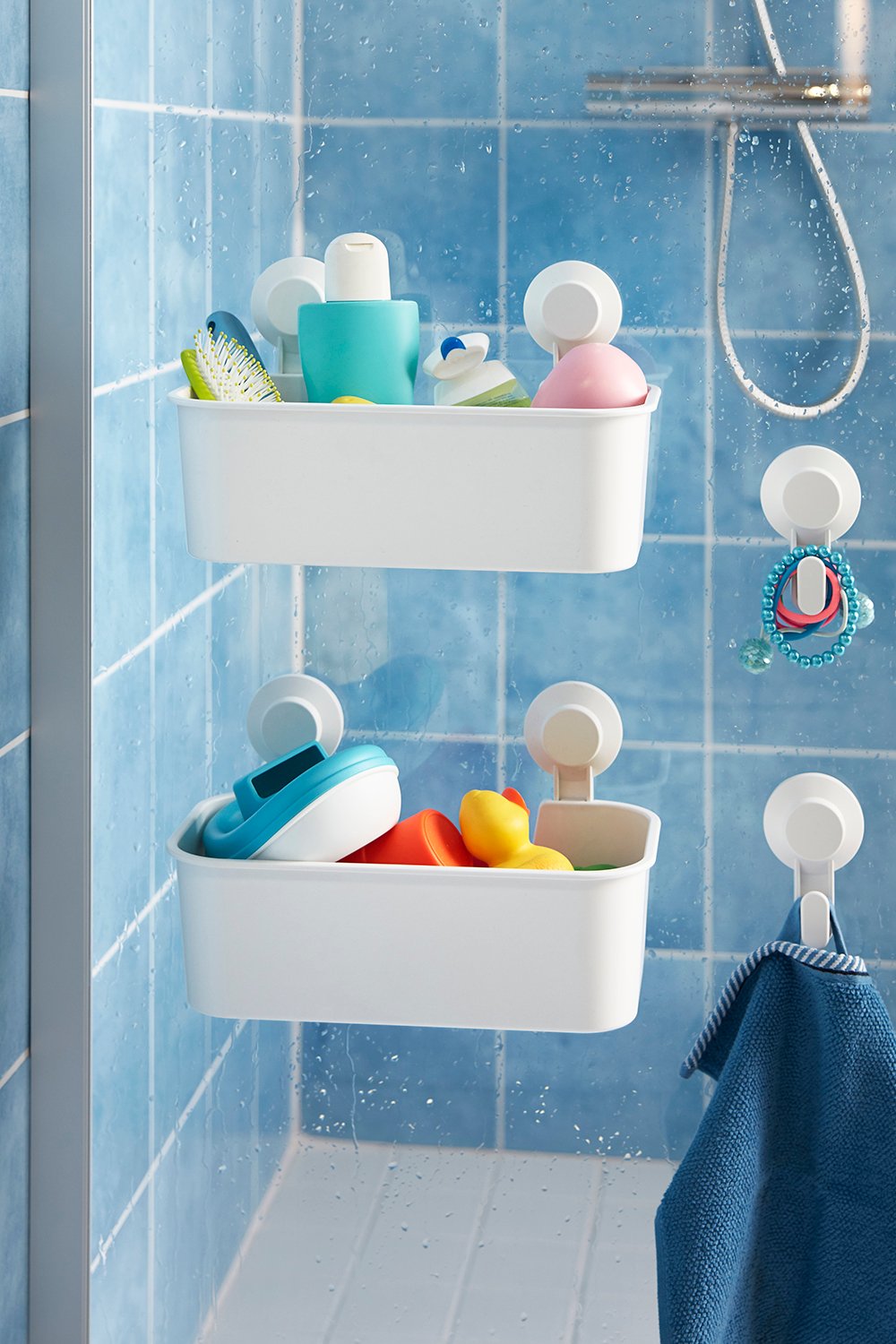 A white TISKEN basket with suction cup