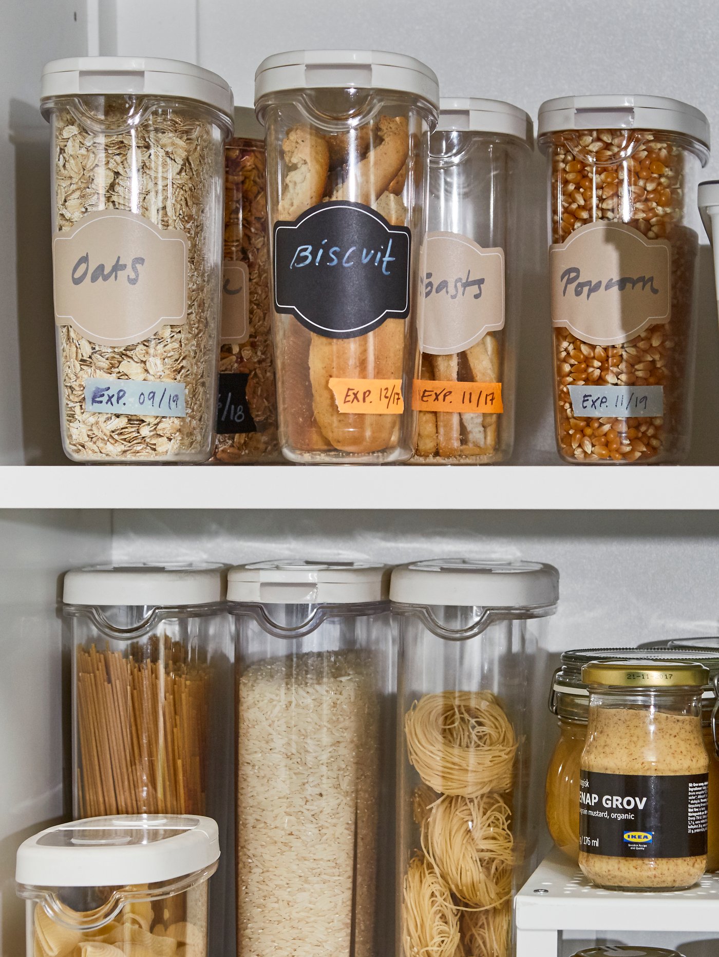 A white UTRUSTA shelf in the kitchen