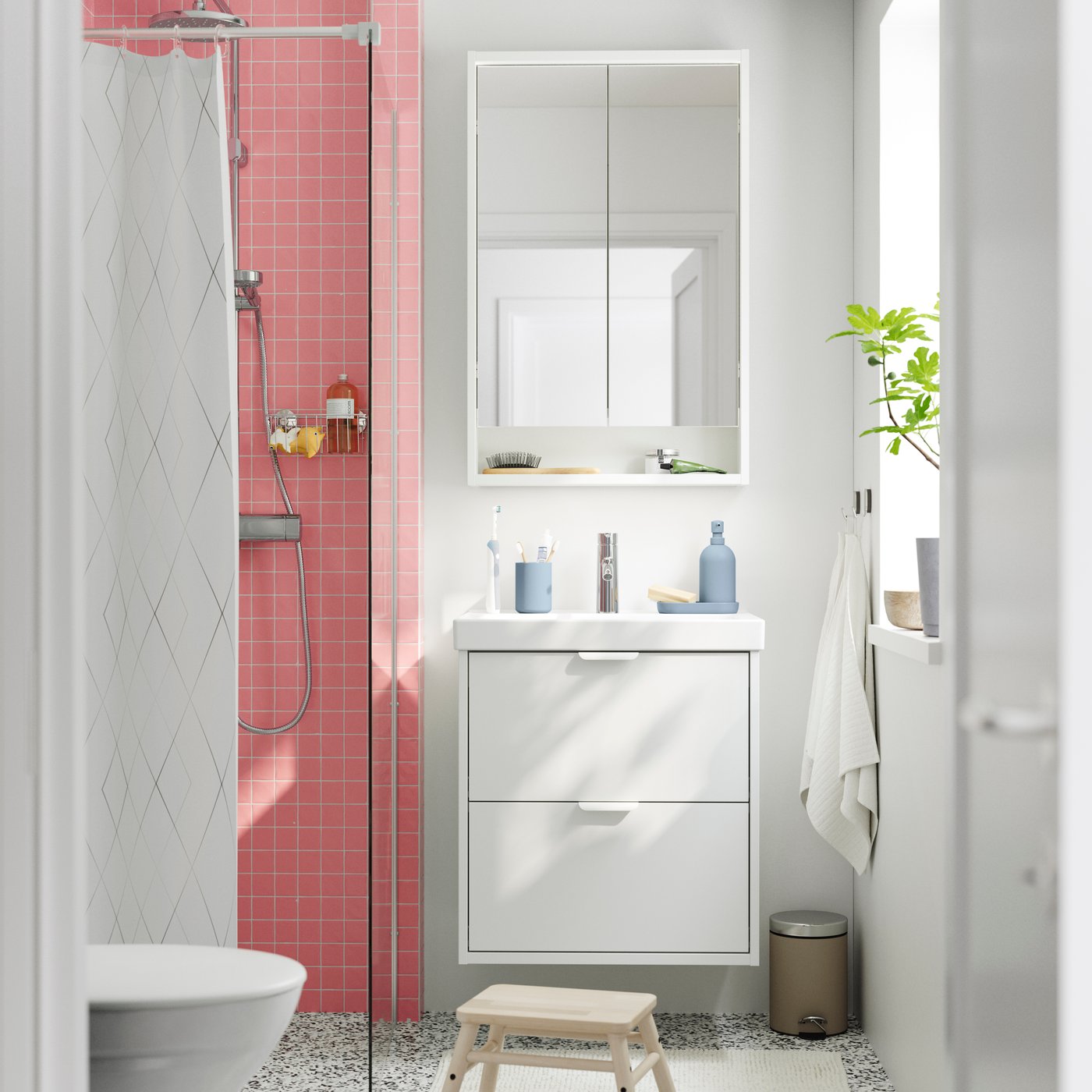 A beige EKOLN waste bin in the bathroom