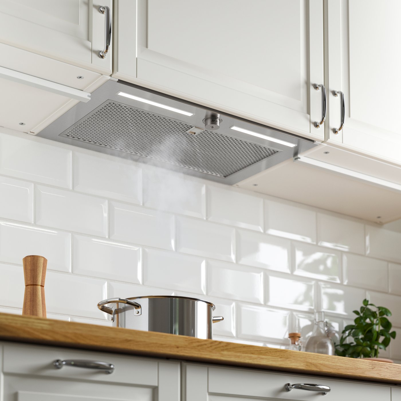 A stainless steel UNDERVERK built-in extractor hood in the kitchen