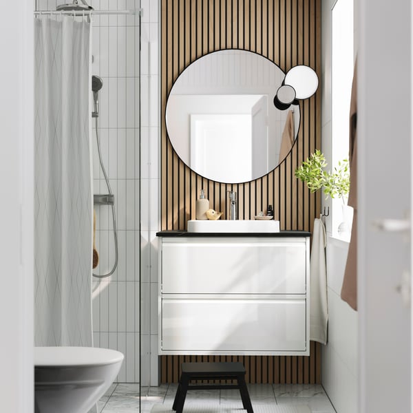 A high-gloss white/black marble effect BACKSJÖN wash-stnd w drawers/wash-basin/tap