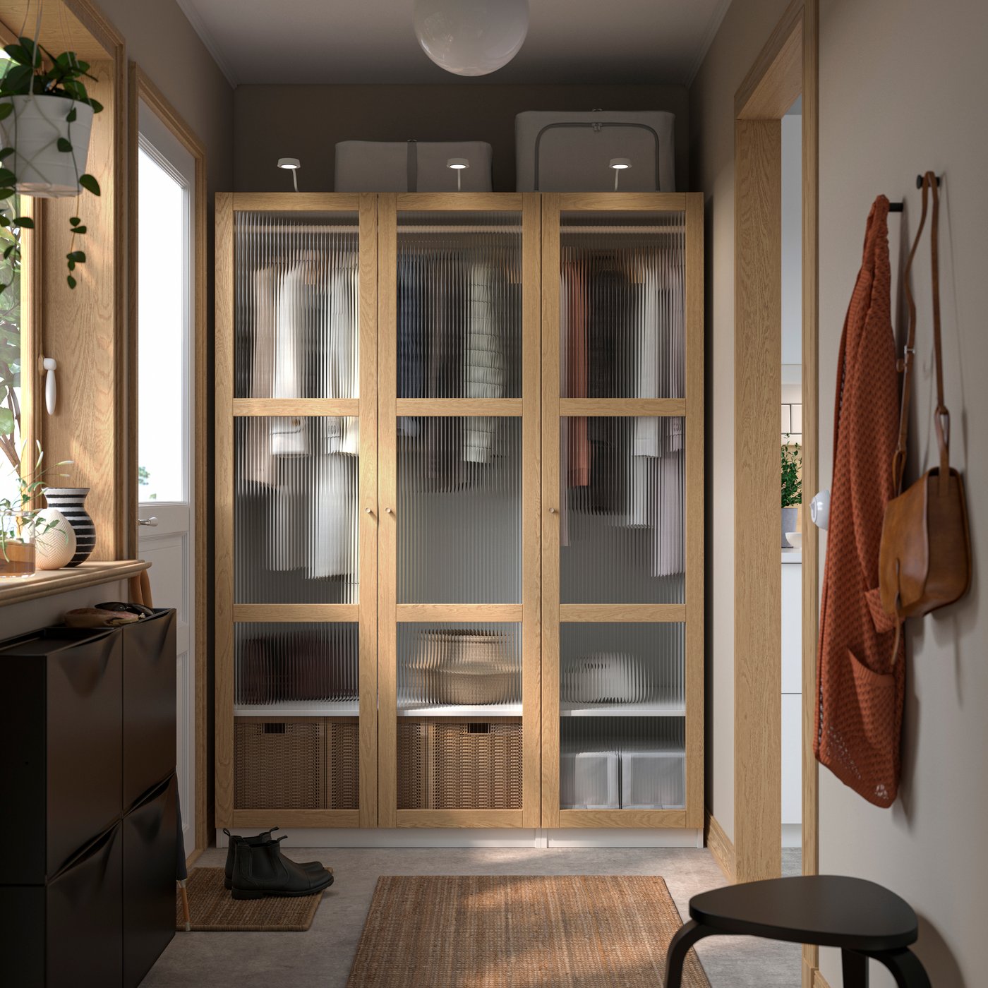 A white/oak veneer glass PAX wardrobe combination