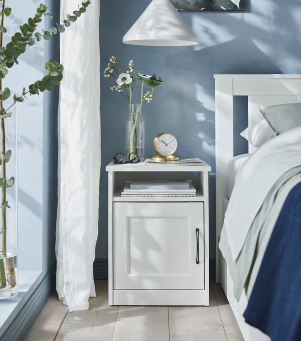 A white SONGESAND bedside table in the bedroom