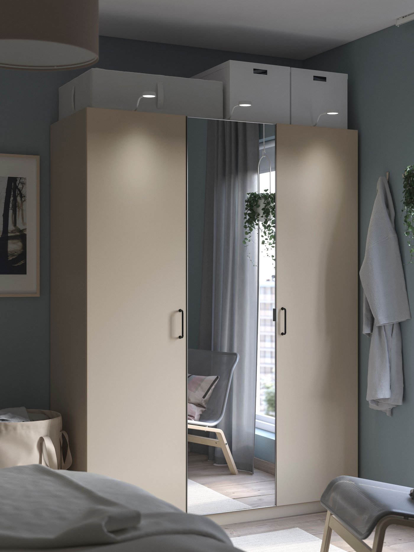A grey-beige/mirror glass PAX wardrobe combination in the bedroom.