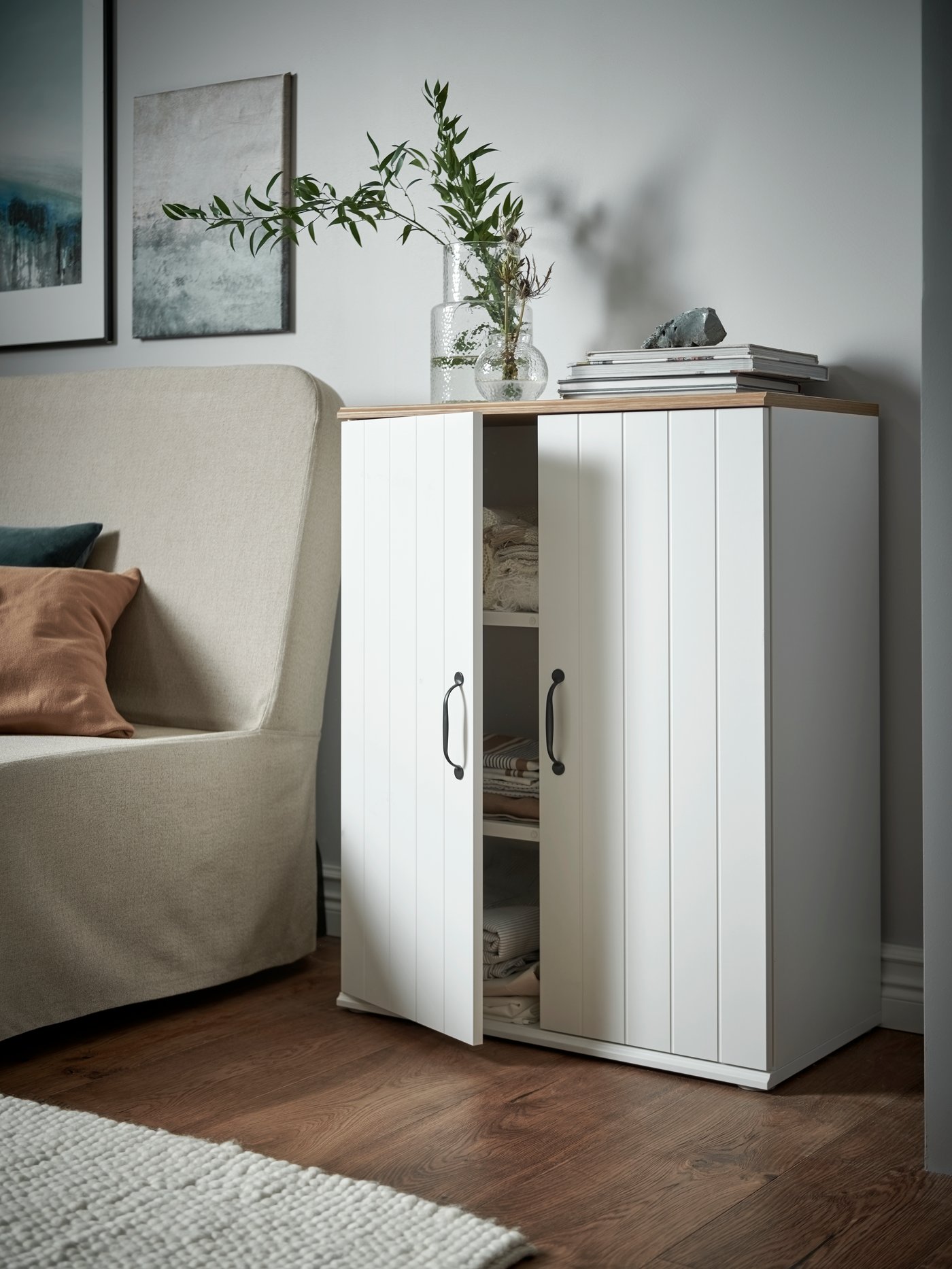 A white SKRUVBY storage cabinet with doors