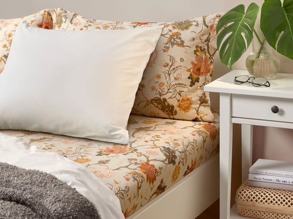 A white stain HEMNES bedside table in the bedroom
