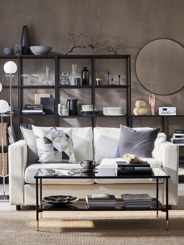 A dark grey SANELA cushion cover in the living room