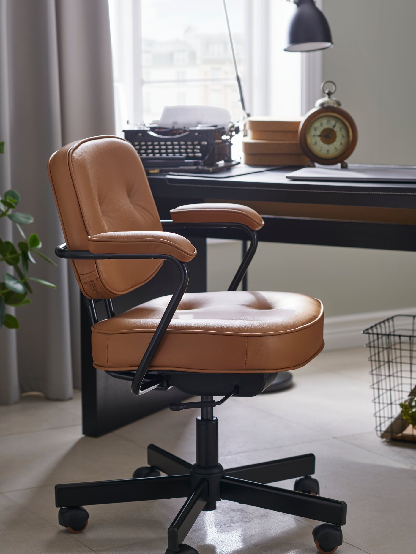 A black-brown MALM desk in the home office