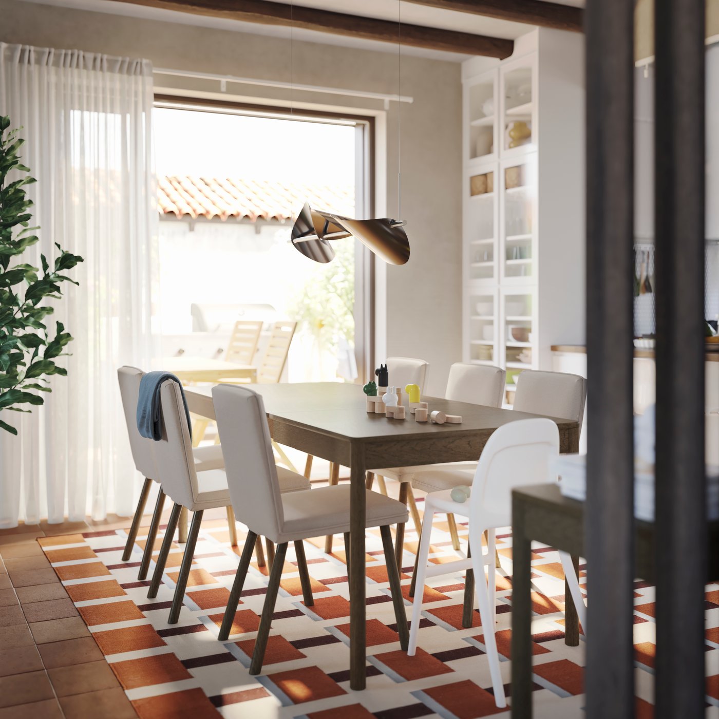 A dining room has a TONSTAD extendable table in brown stained oak veneer with six chairs and a cabinet with glass doors.