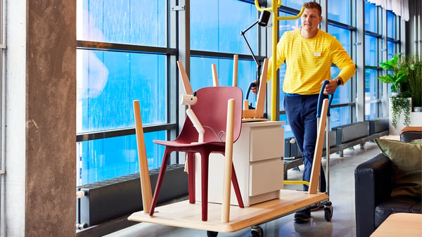 A IKEA employe returing IKEA furniture.