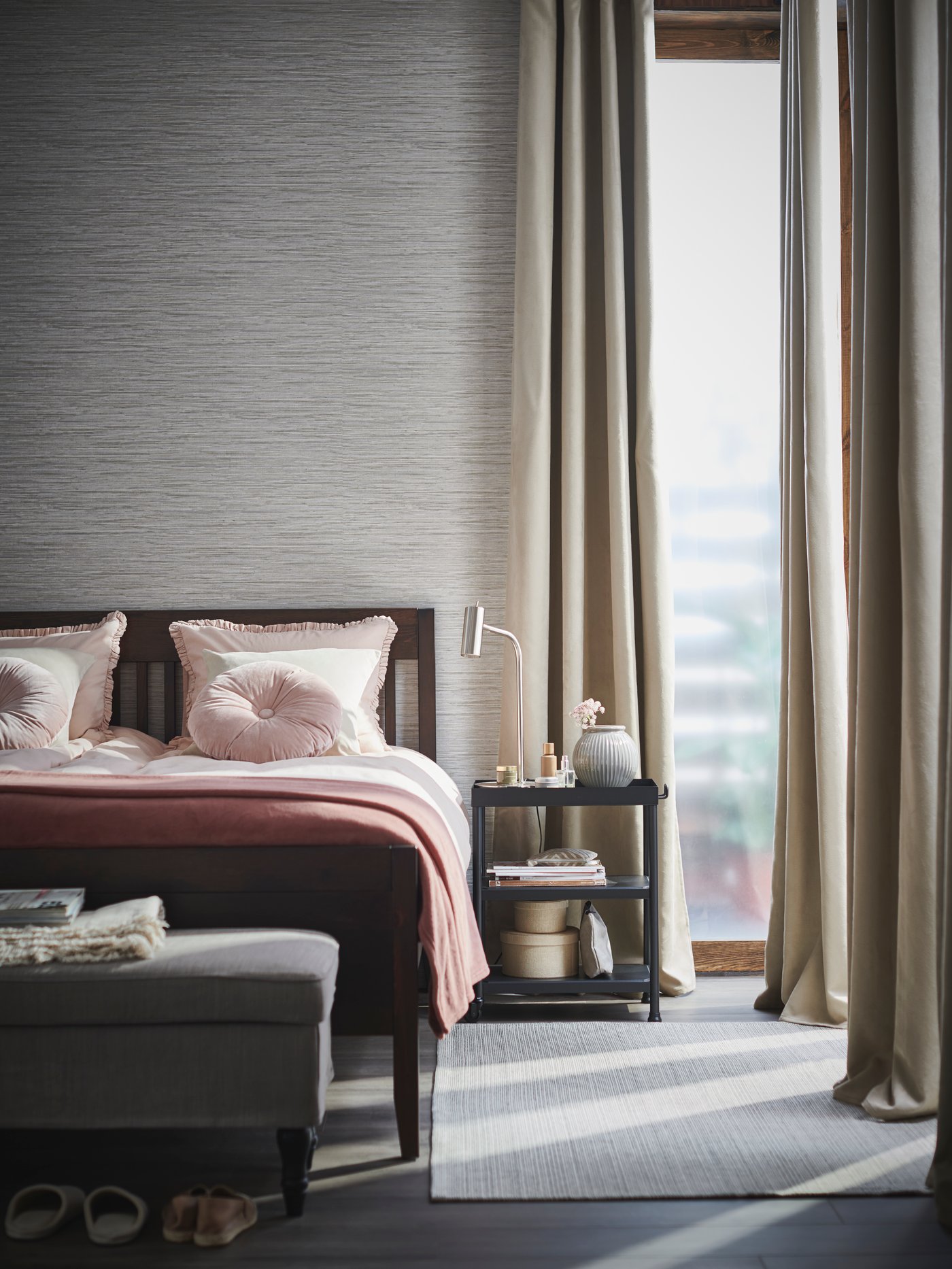 A beige BIRTNA block-out curtains, 1 pair in the bedroom