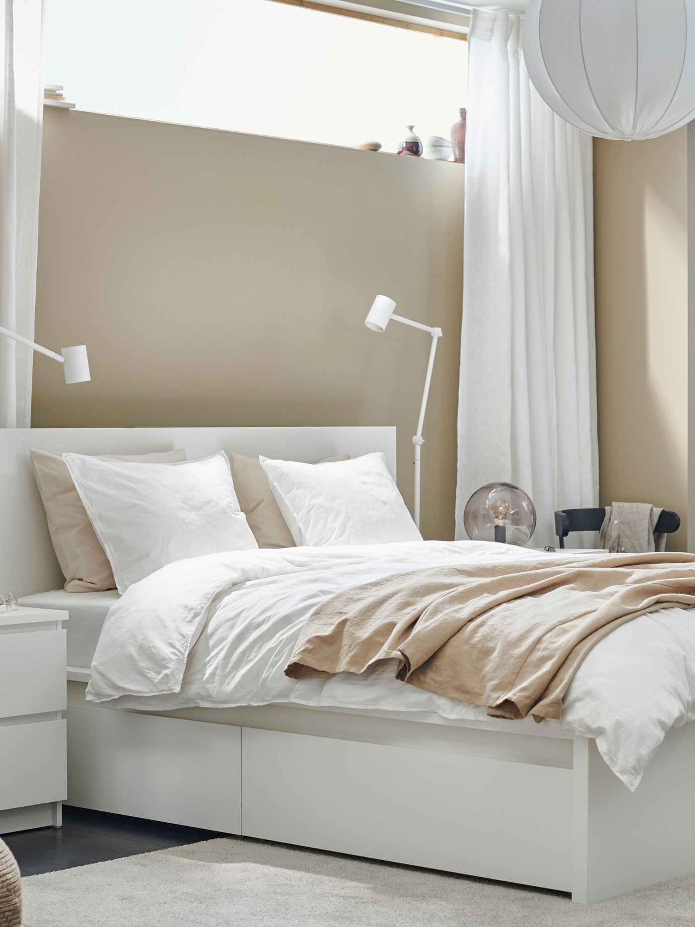 A white MALM chest of 2 drawers