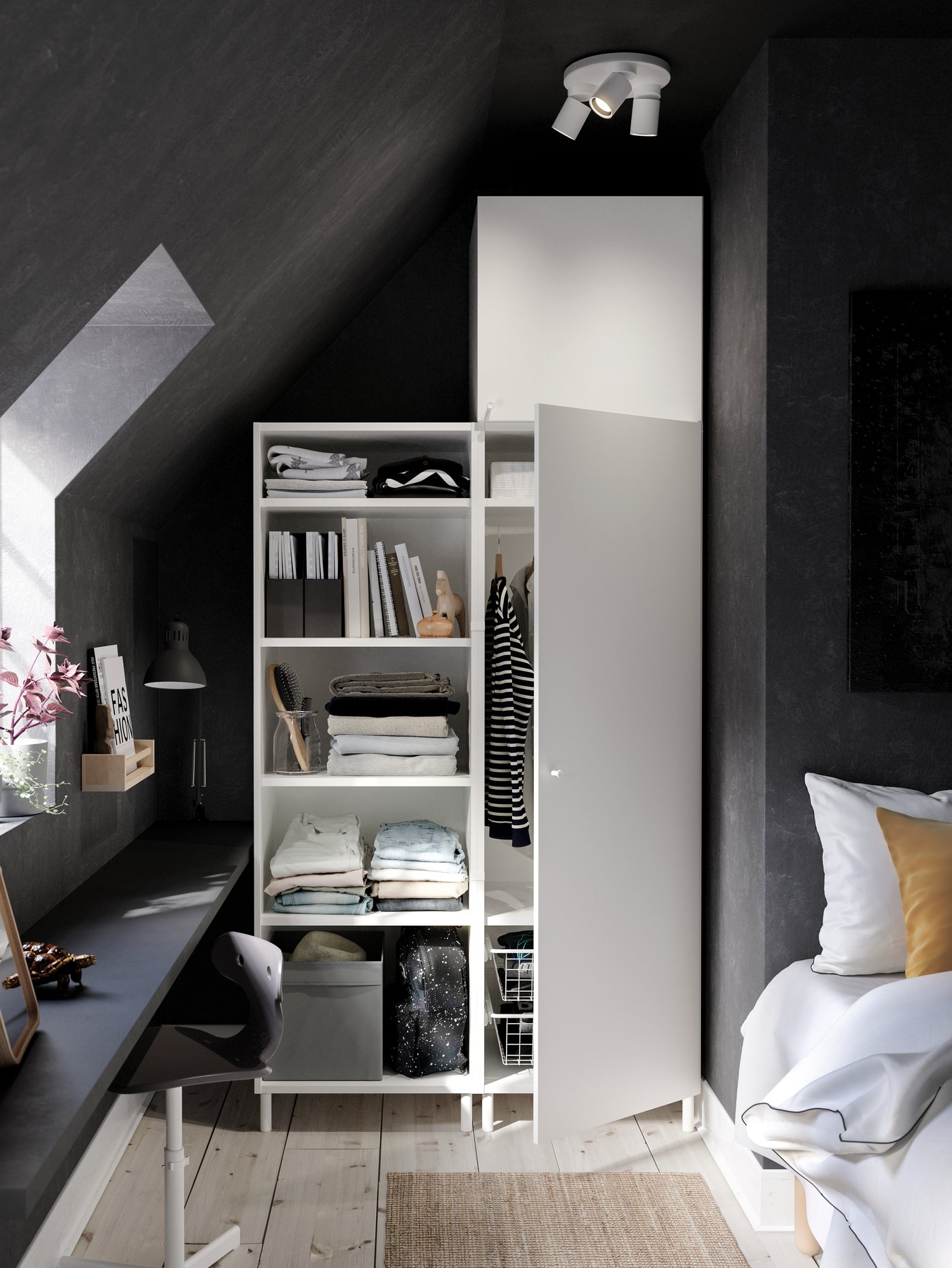 A large PLATSA wardrobe with elements of different heights holding clothes, a storage case, boxes, weights and a football.