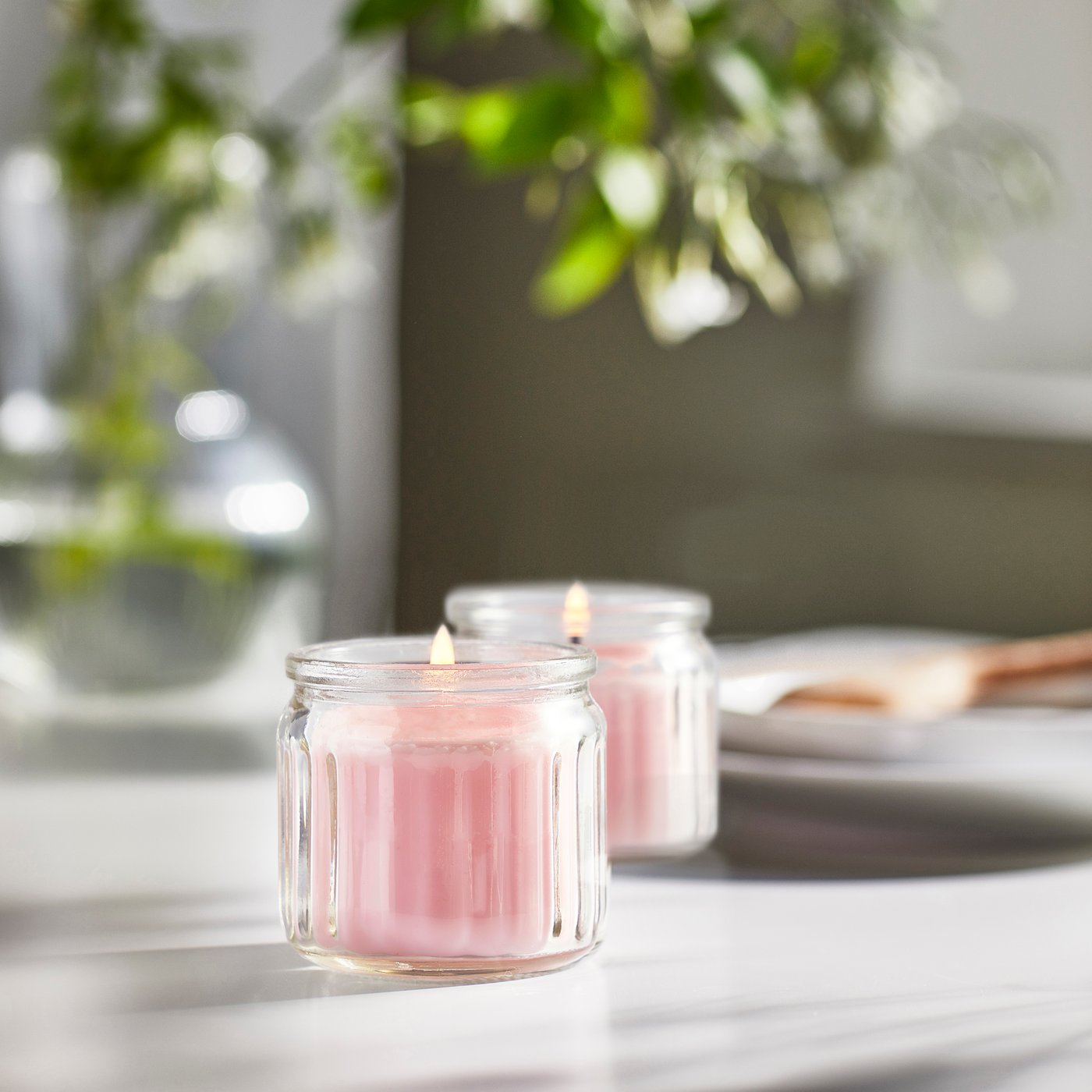 A Jasmine/pink LUGNARE scented candle in glass