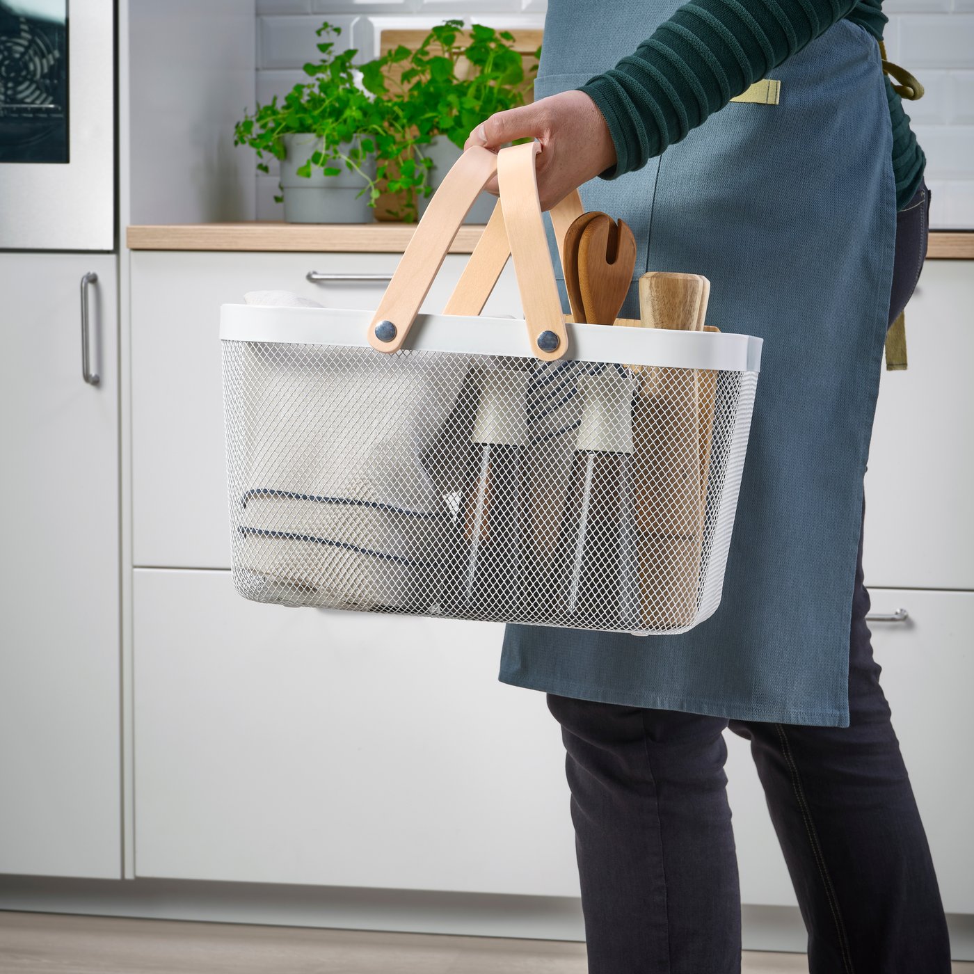 A white RISATORP basket in the kitchen