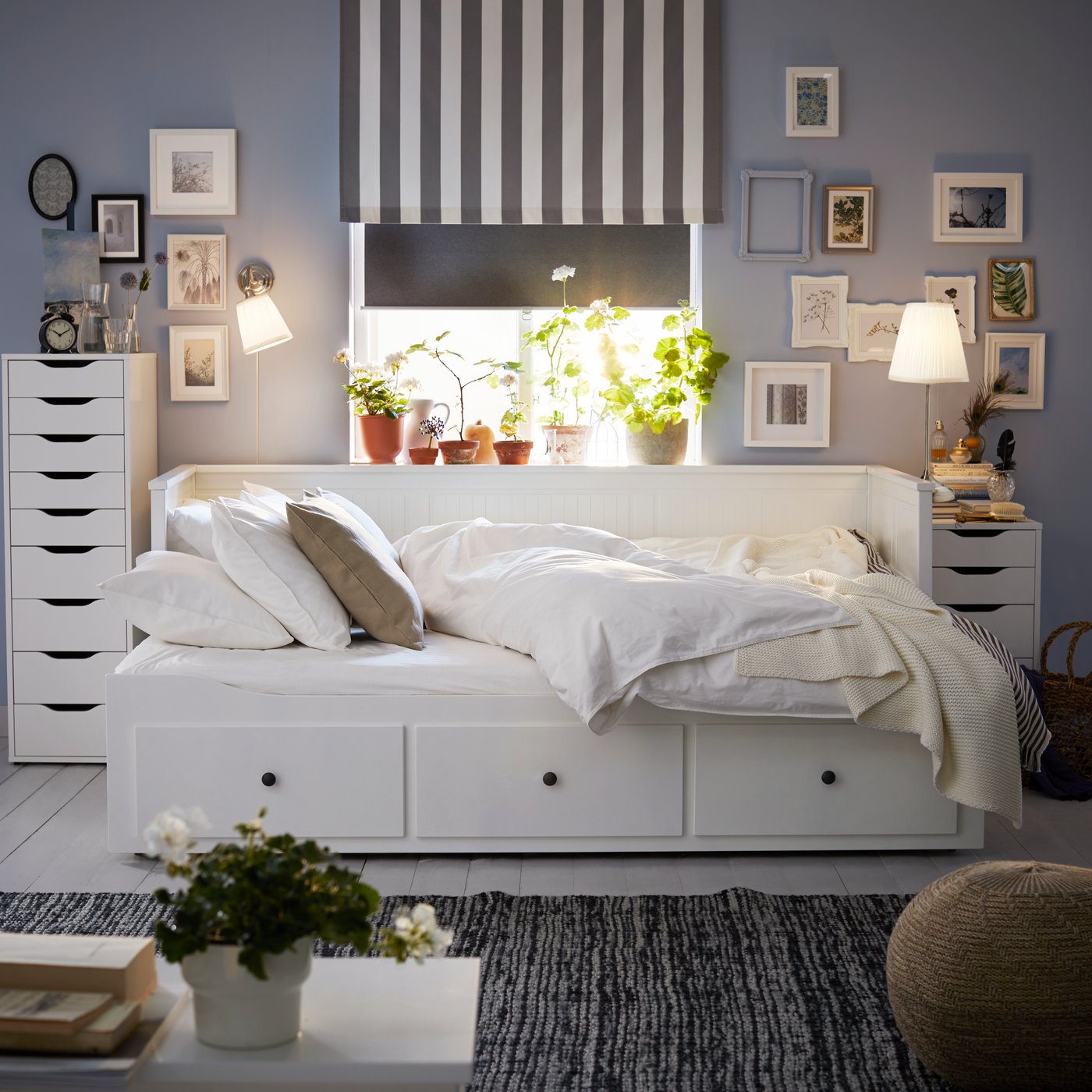 A white HEMNES day-bed frame with 3 drawers in the bedroom