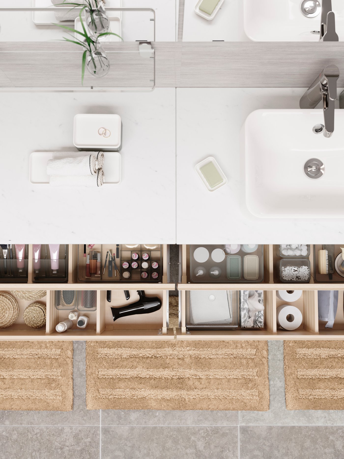 A white wash-stand with boxes and rolled-up towels, two drawers open revealing neatly organised GODMORGON boxes.