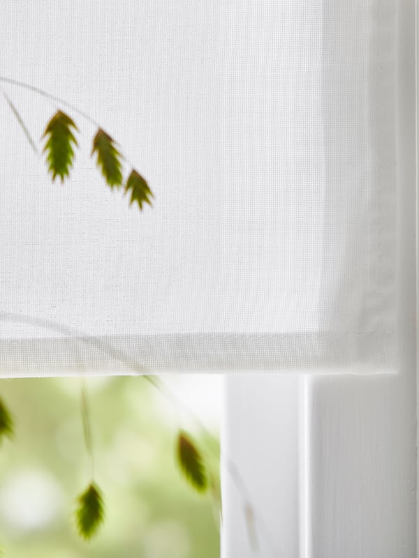 A white RINGBLOMMA Roman blind