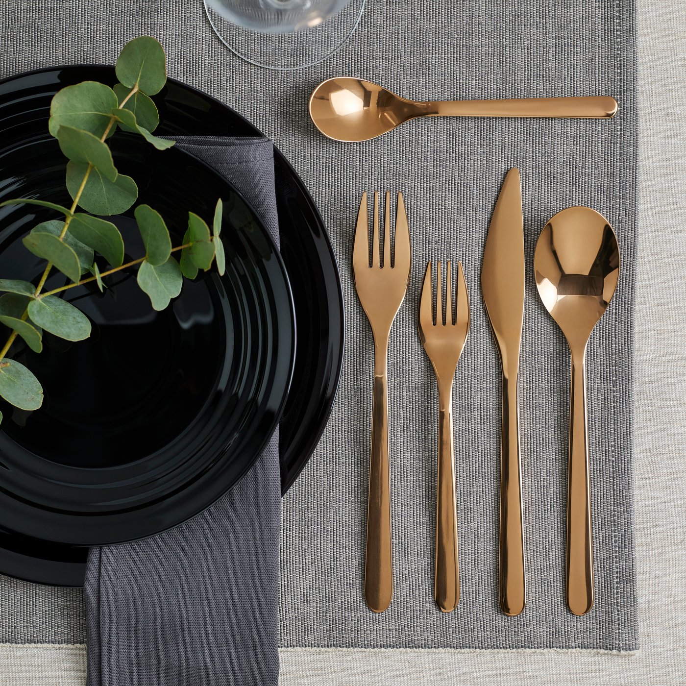A rose-gold colour FÖRNUFT 24-piece cutlery set