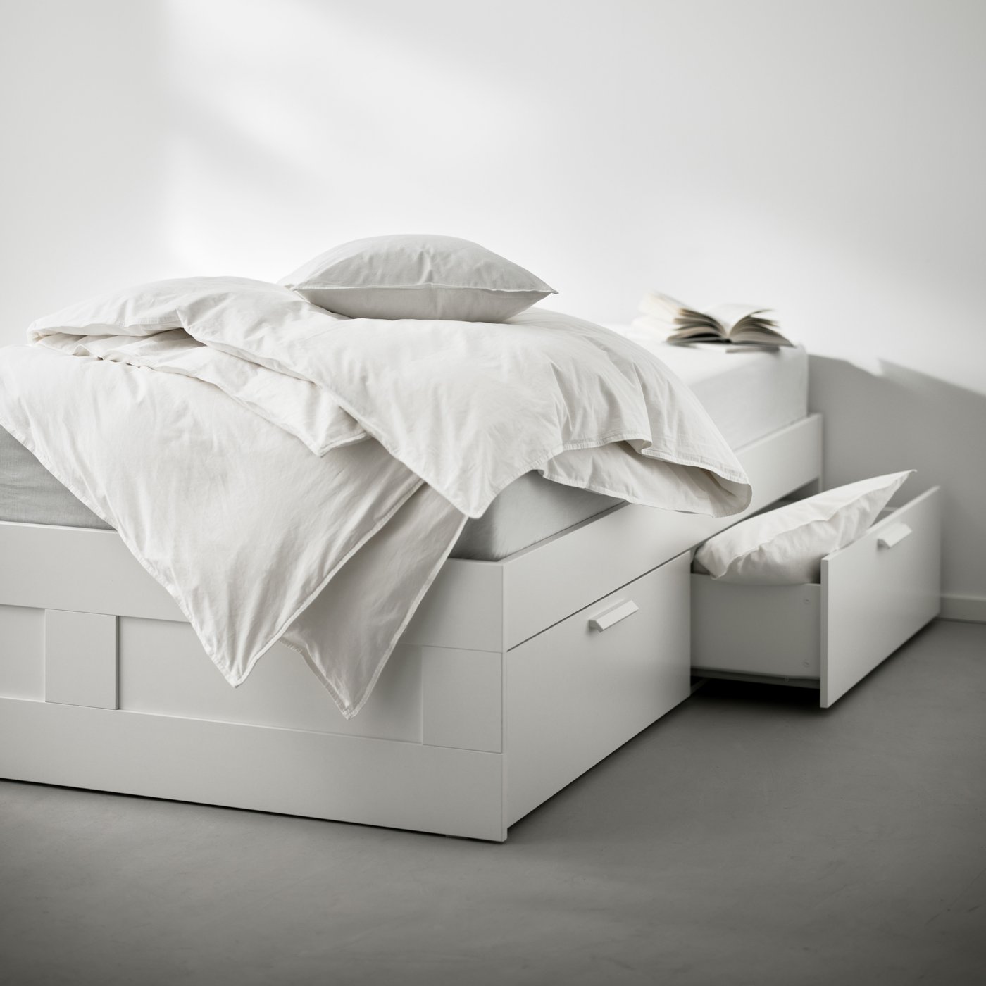 A white BRIMNES ottoman bed