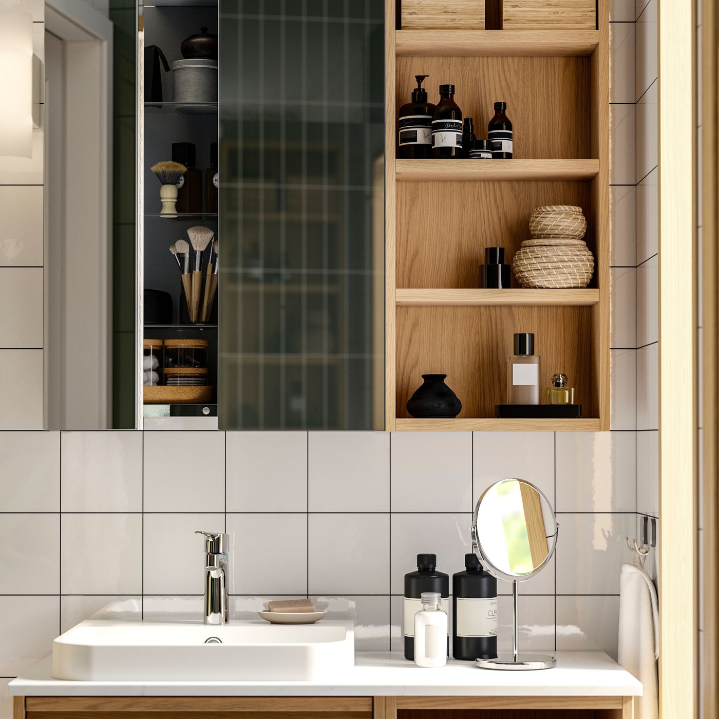 A white wash-stand, a white mirror, a white trolley with trays and jars and a white high cabinet in a grey-tiled bathroom.