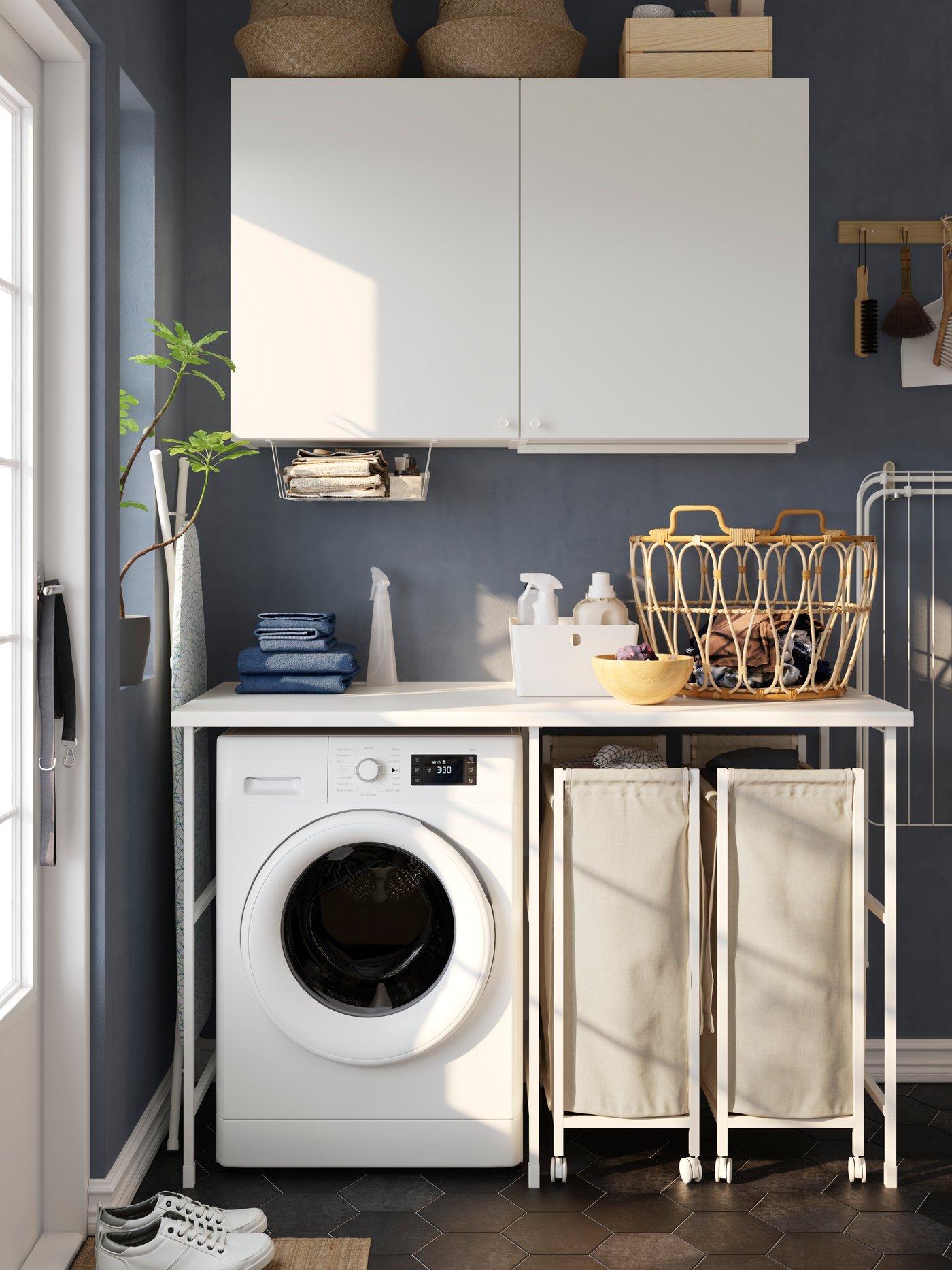 A white ENHET storage combination in the laundry room