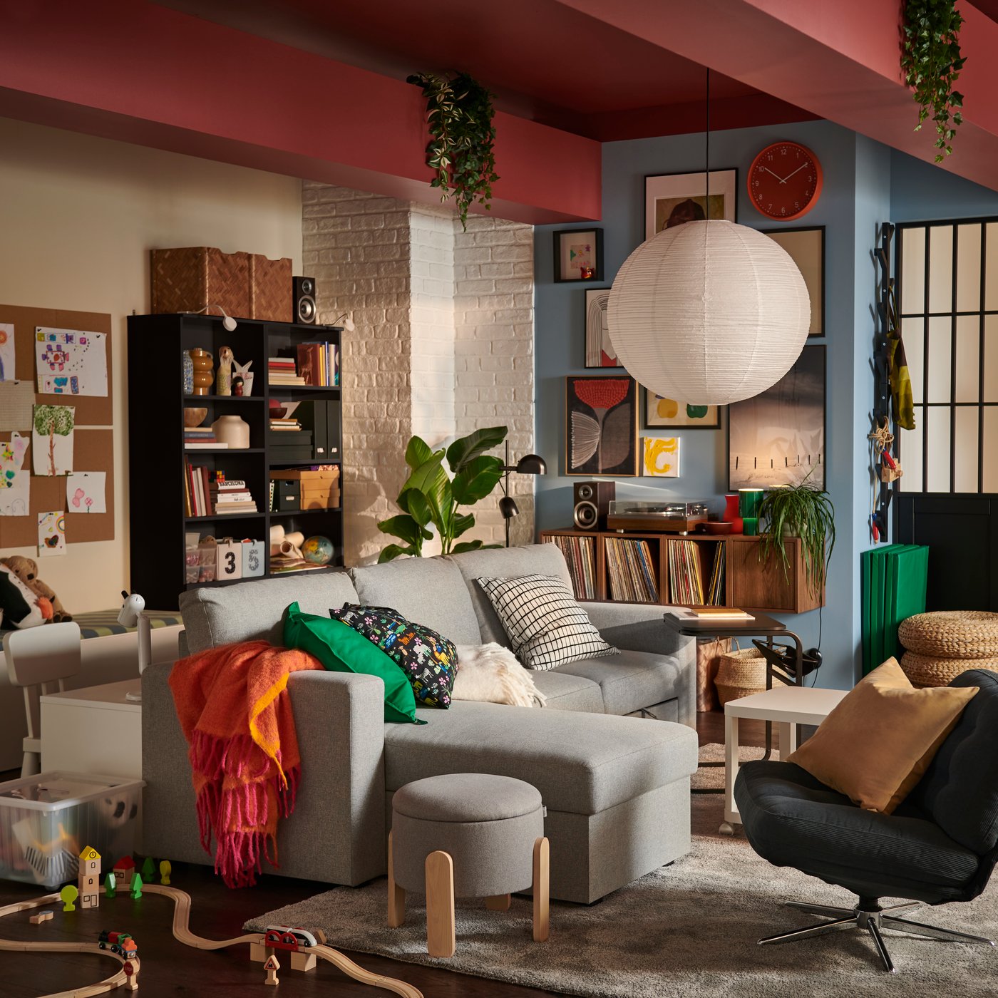 A light living room featuring a beige/grey BÅRSLÖV 3-seat sofa-bed with chaise longue, surrounded by playful decor.