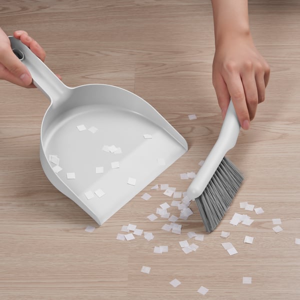 A grey PEPPRIG dust pan and brush