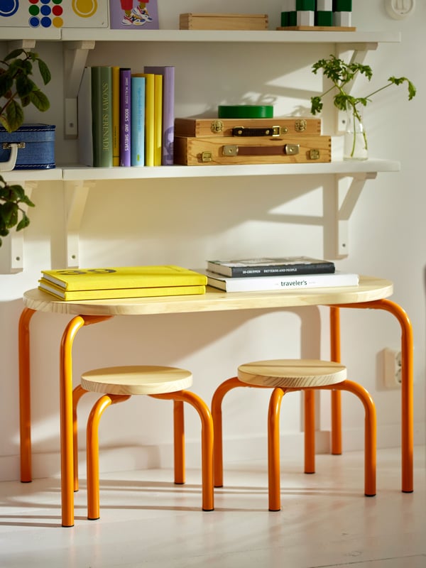 A wood/orange GREJSIMOJS children's table