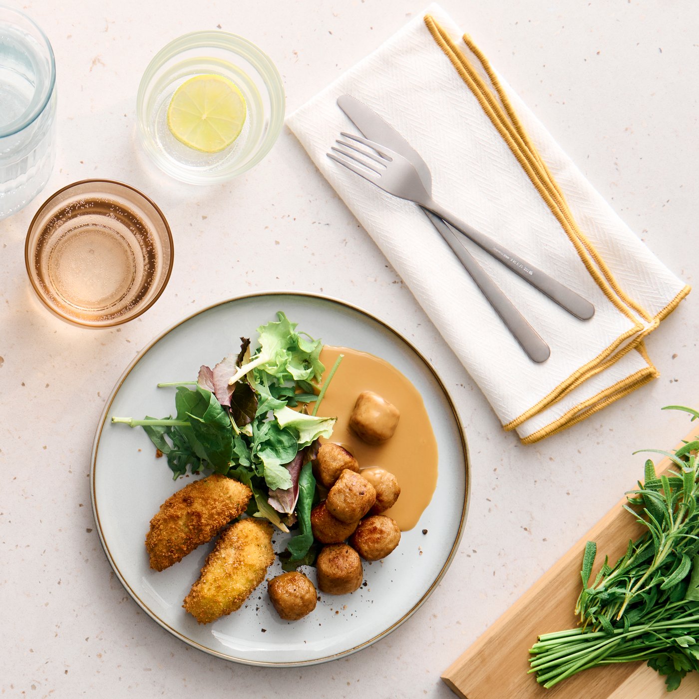 Chicken meatballs with vegetable croquettes served on a table waiting to be enjoyed.