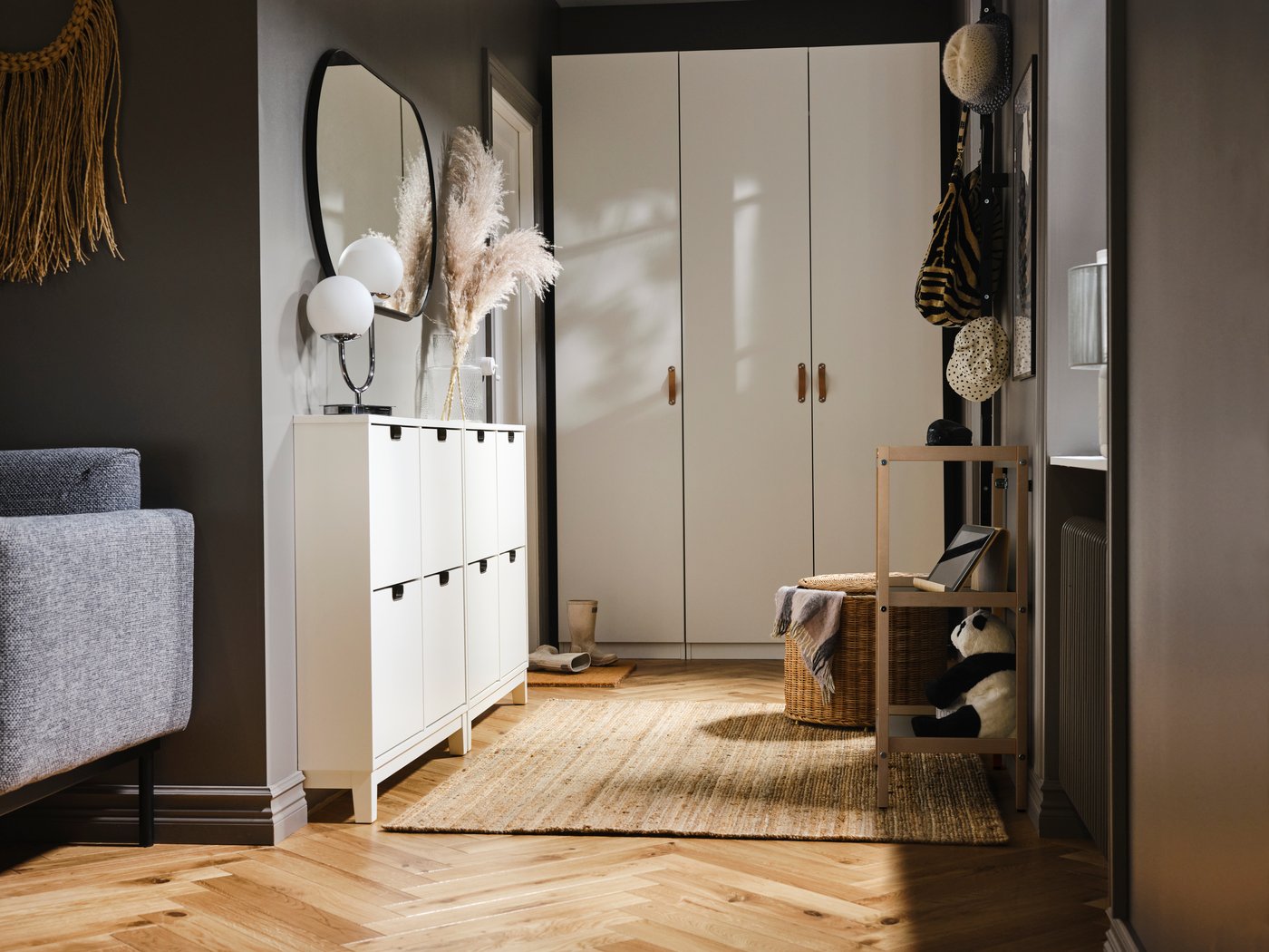 A white STÄLL shoe cabinet with 4 compartments