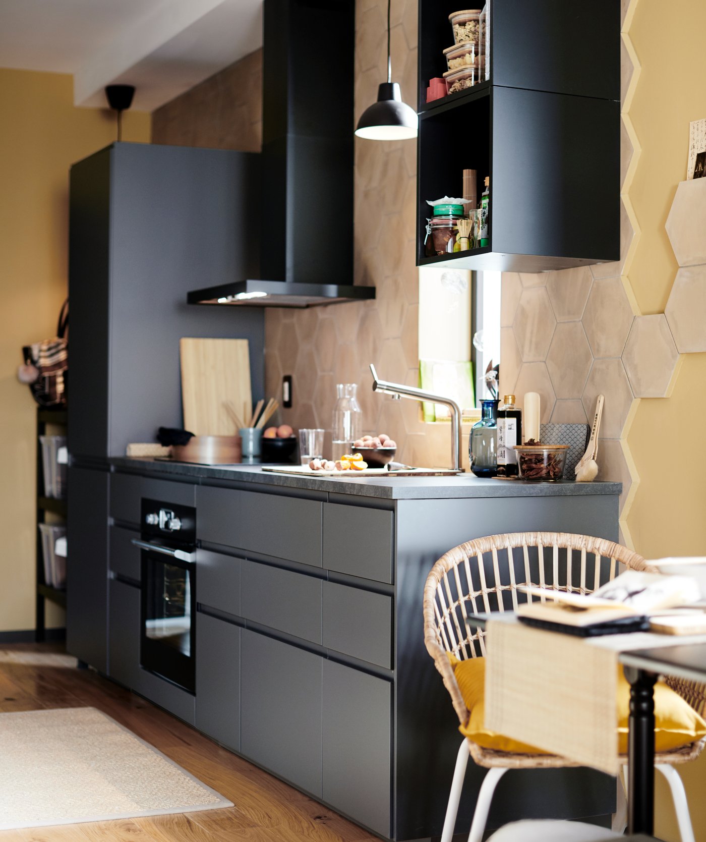 A stainless steel colour BOSJÖN kitchen mixer tap in the kitchen.