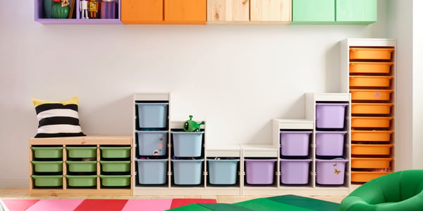 A light white stained pine TROFAST wall storage in the childrens room