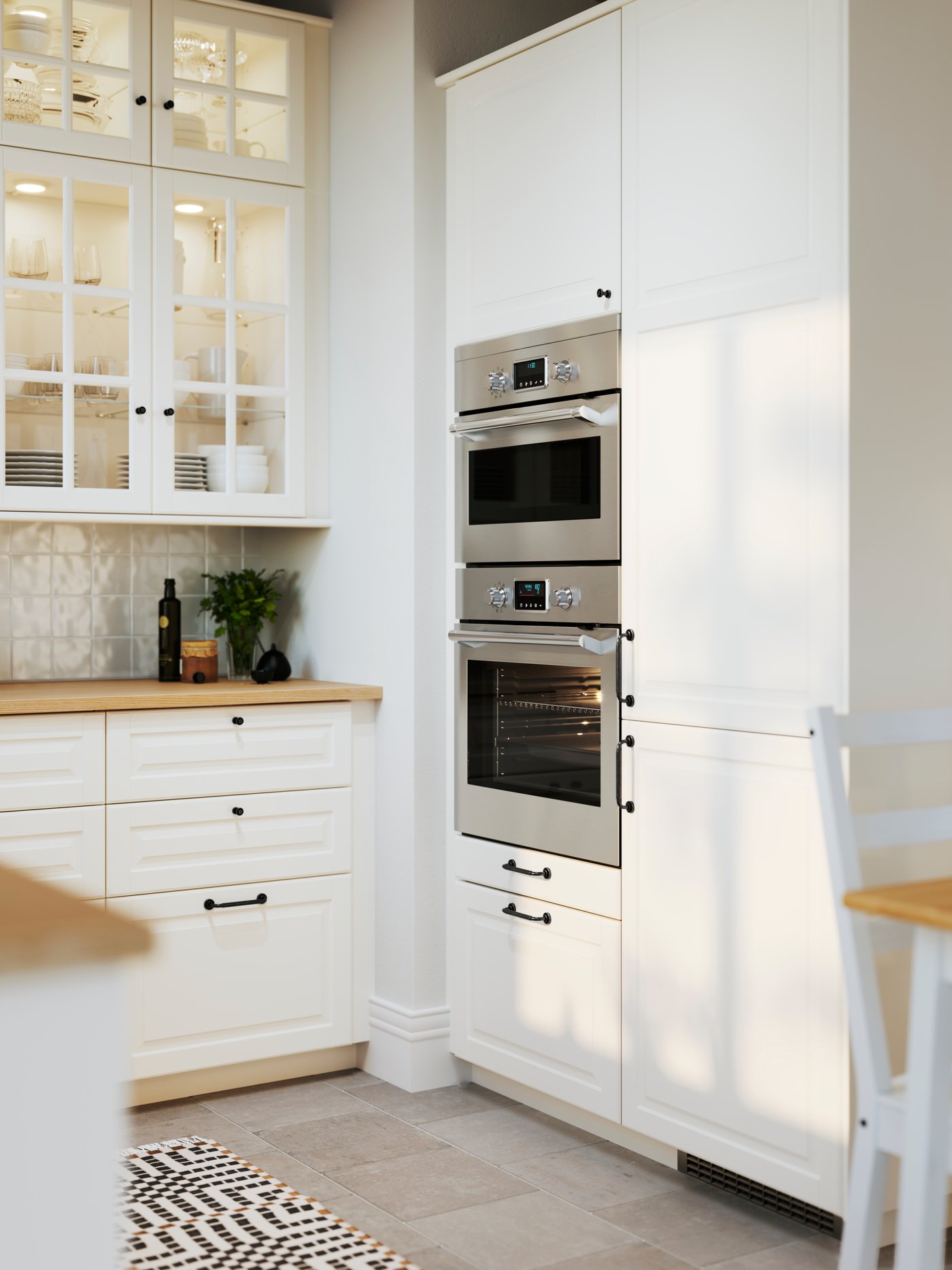An off-white BODBYN door with hinges in the kitchen