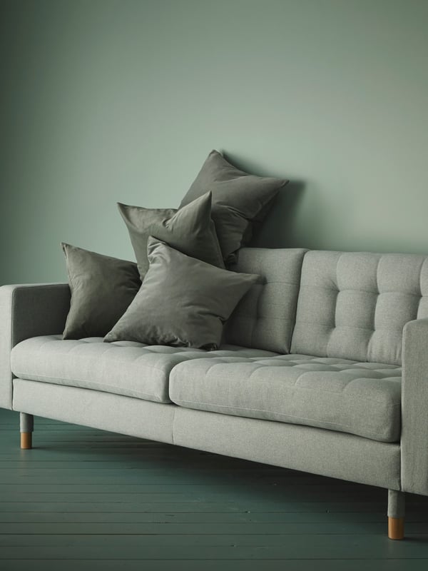 A LANDSKRONA sofa in green with pillows