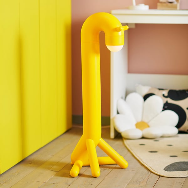 A giraffe/yellow battery-operated GREJSIMOJS LED decoration lighting, floor in the childrens room
