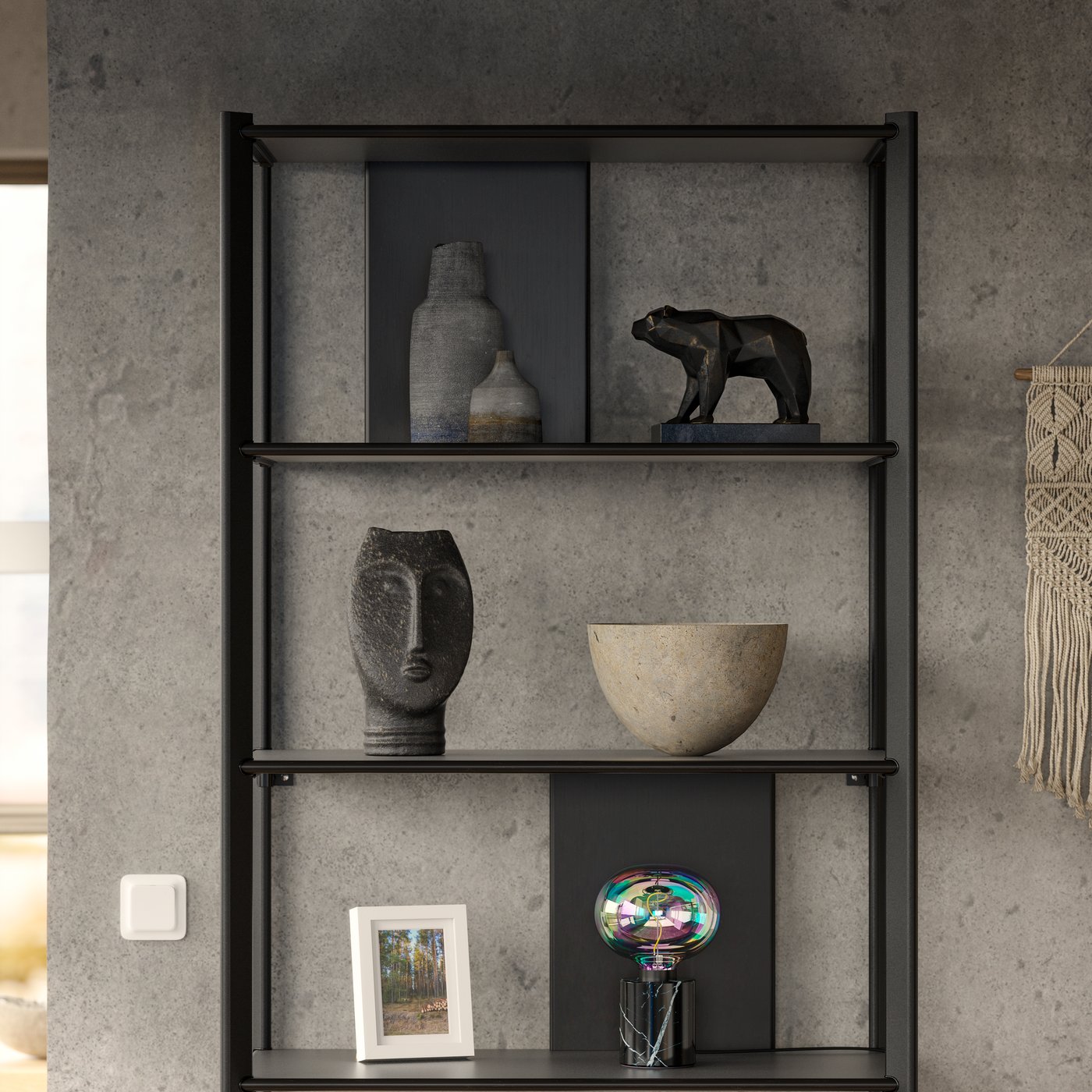 A black JÄTTESTA shelving unit