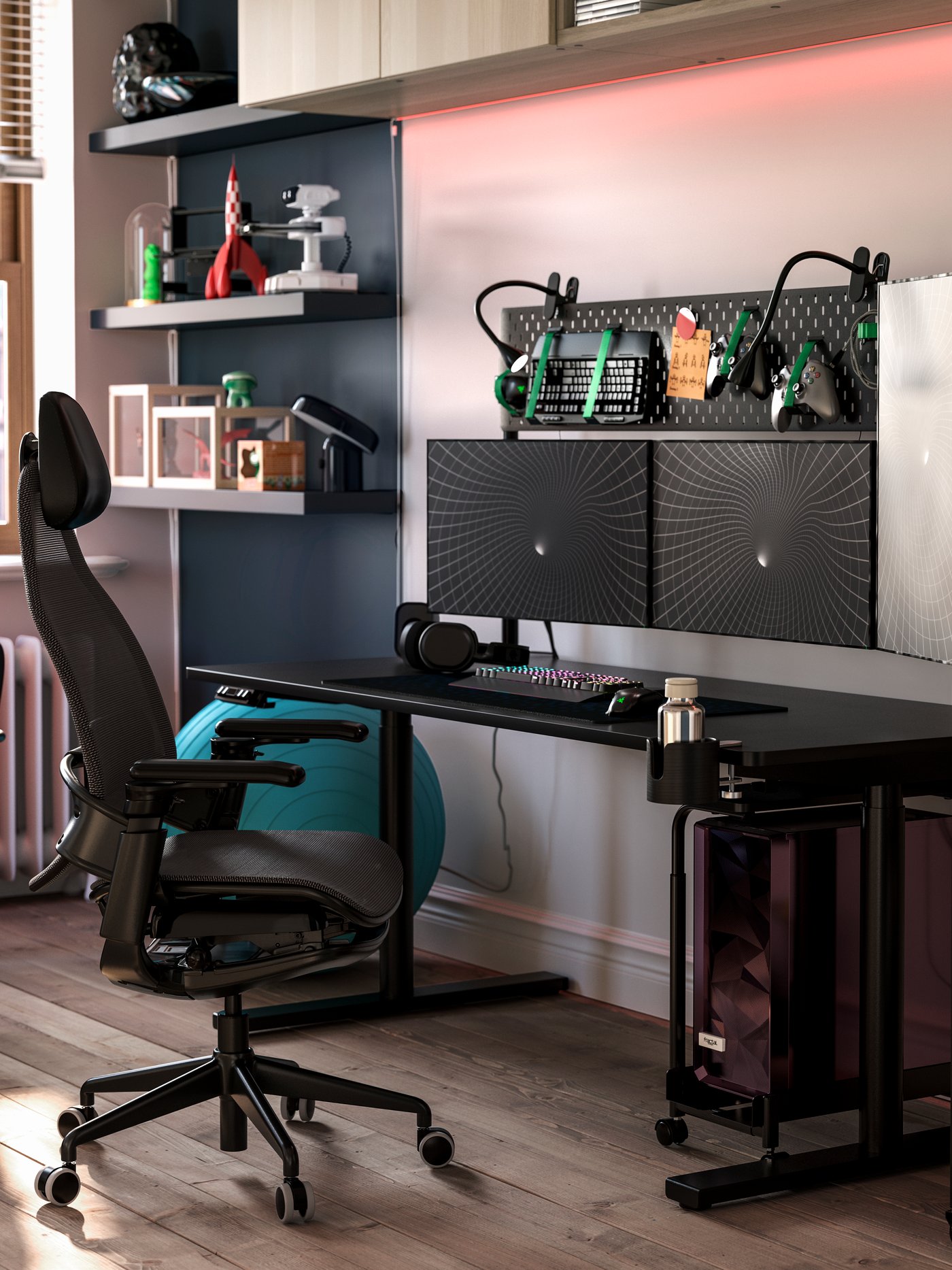 A black MÅLOMRÅDE sit/stand gaming desk is featured in a stylish room with shelves, a gaming chair and gaming gear.
