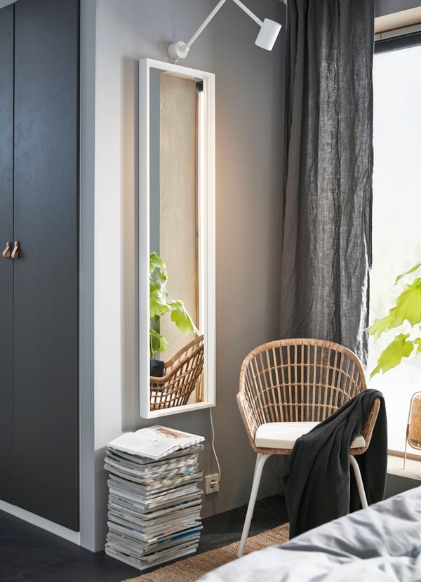 A white NISSEDAL mirror in the bedroom