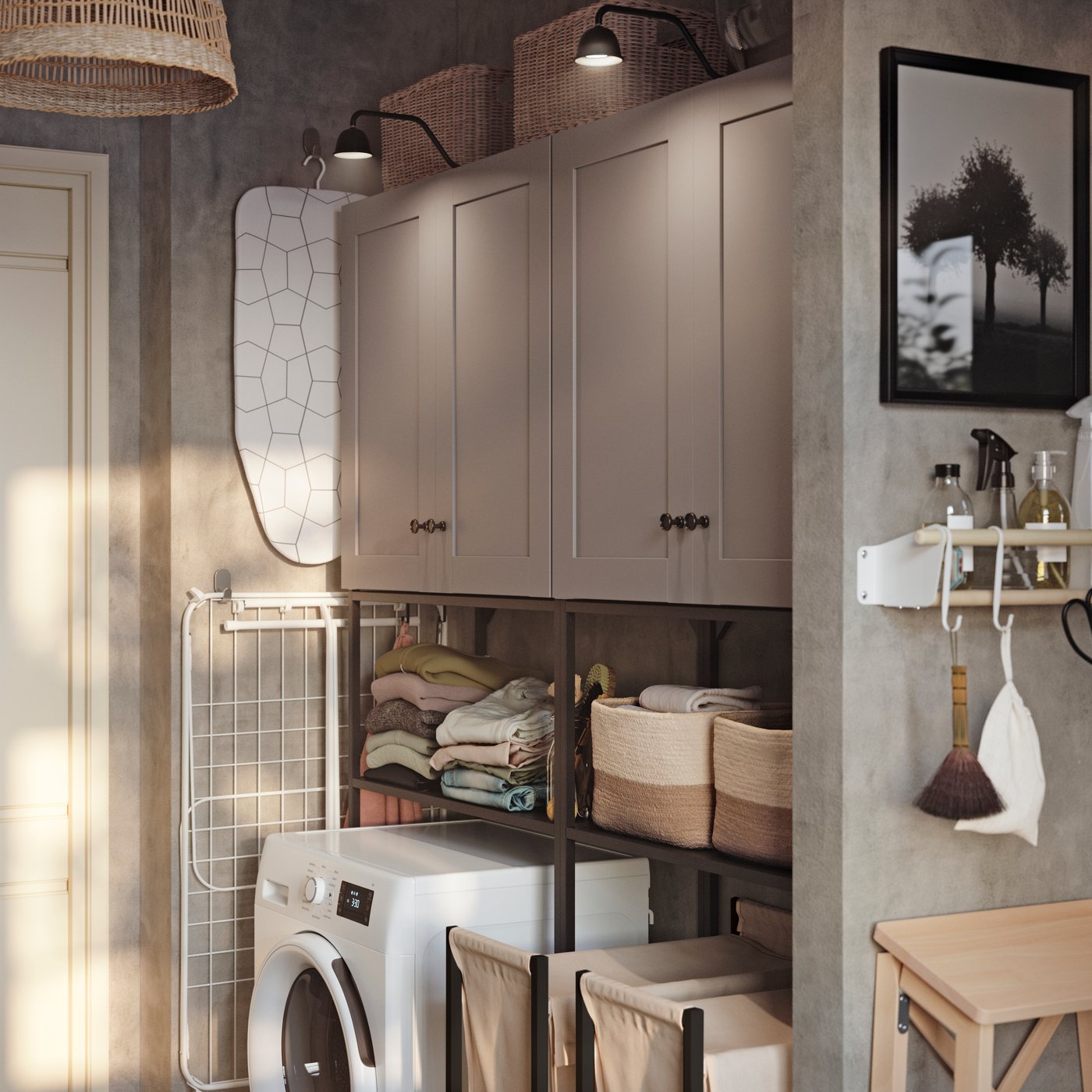 A small grey laundry room has an ENHET storage combination with grey fronts, open shelves and a white washing machine.