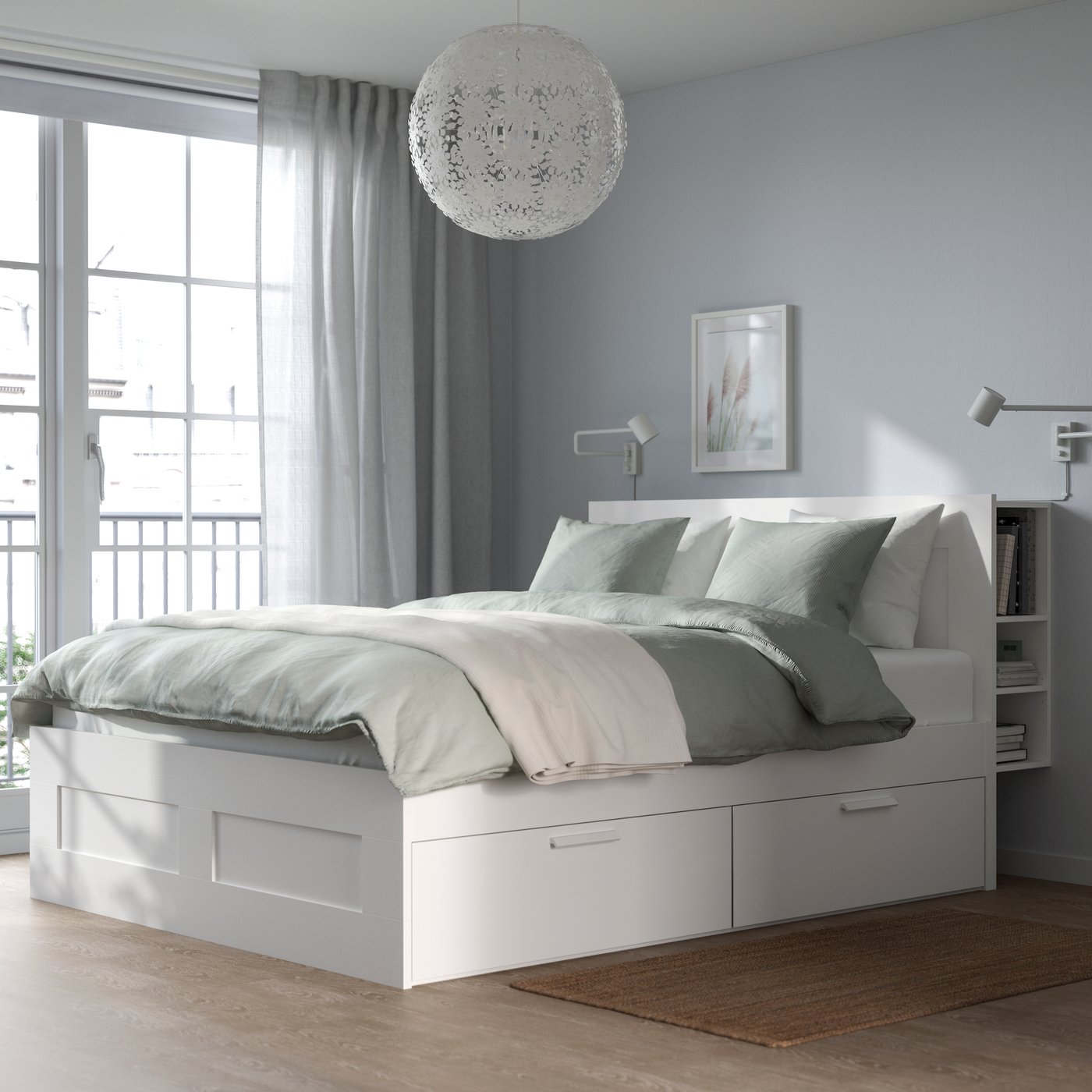 A white GRIMSÅS pendant lamp in the bedroom
