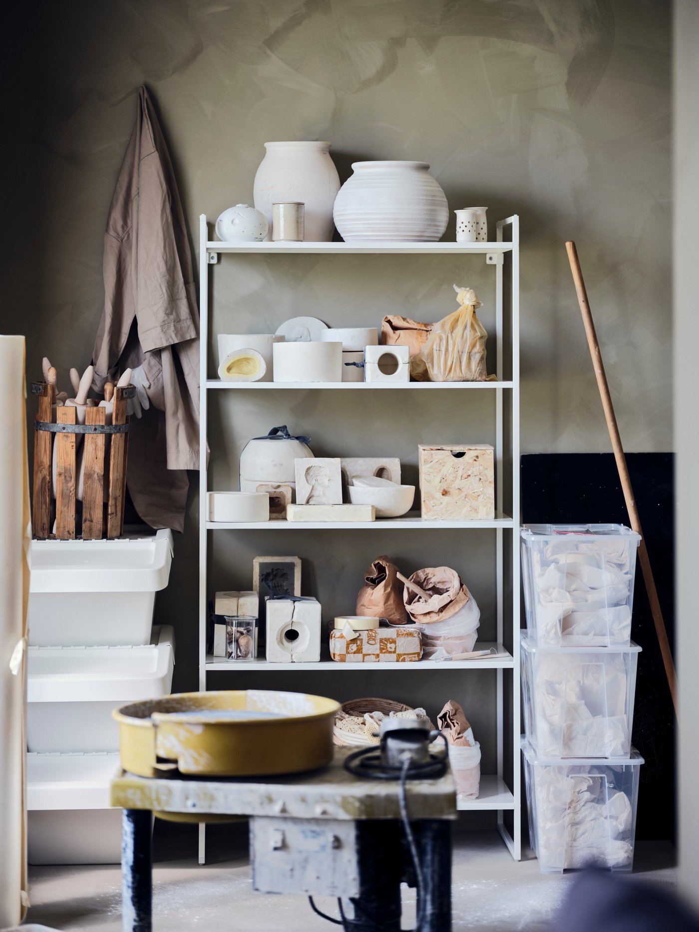 A white JONAXEL shelving unit in the home office