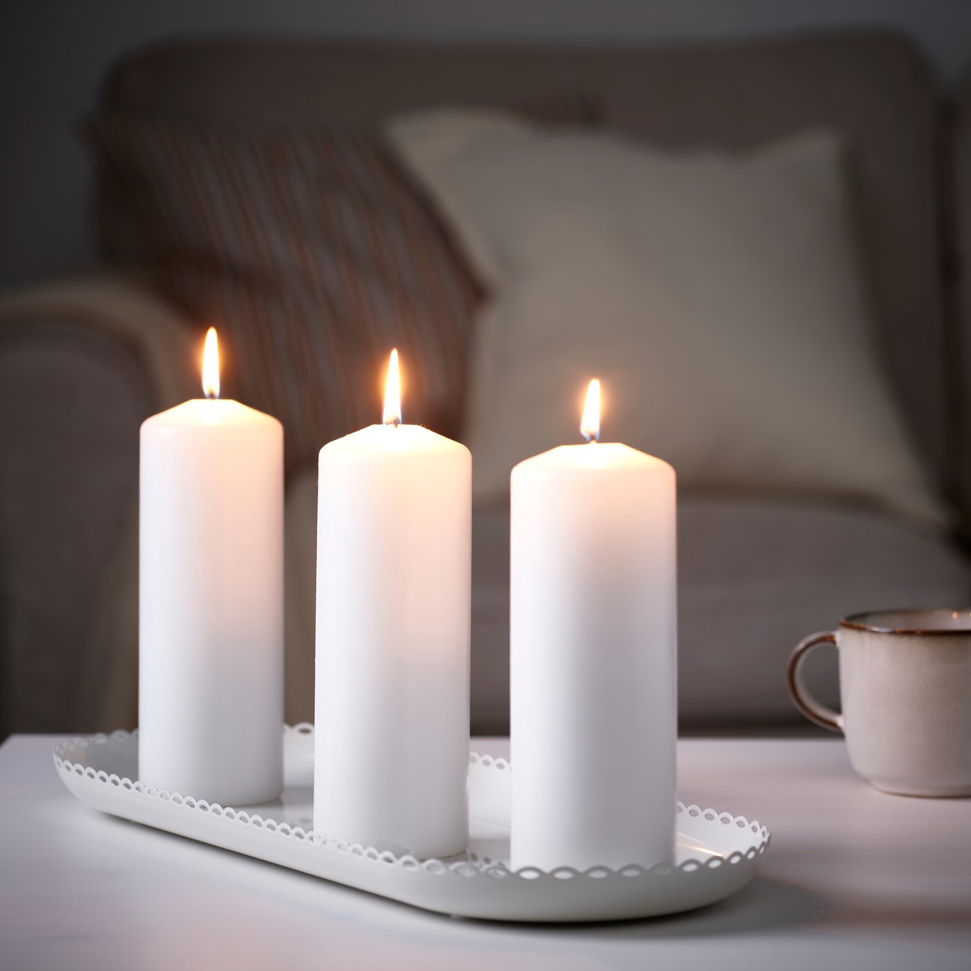 An off-white TURTURDUVA candle dish in the living room