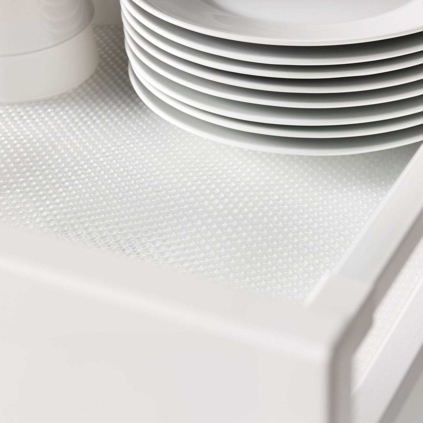 A transparent VARIERA drawer mat