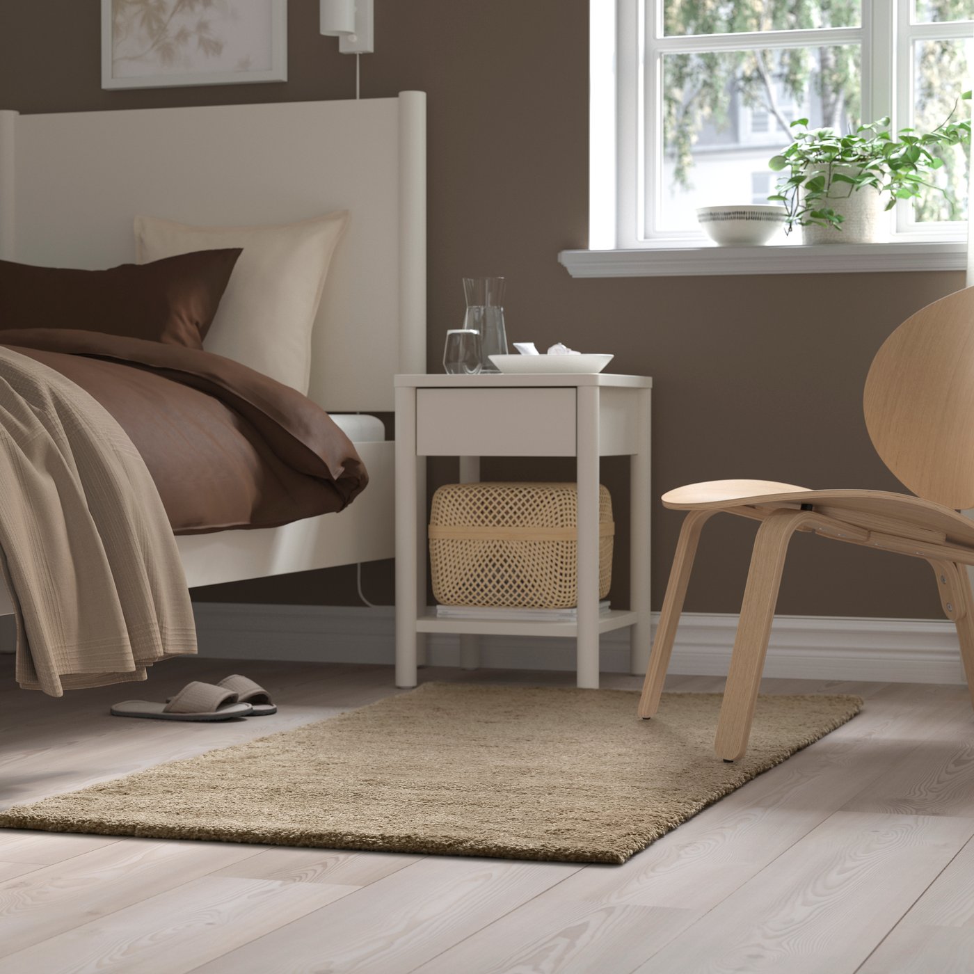 A beige STOENSE rug, low pile